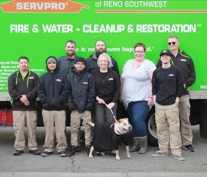 SERVPRO employees and owner standing in front of their green box truck