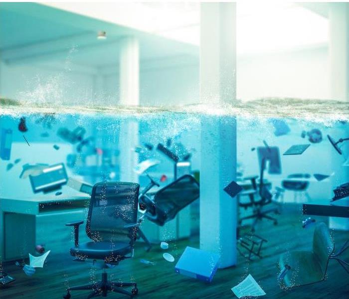 office furniture and supplies submerged under water in an office room