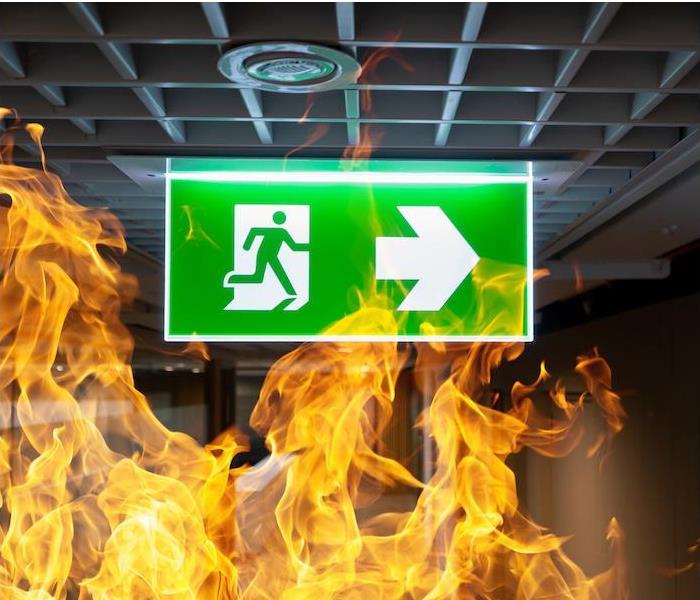  img src =”firesign.jpg” alt = “a green exit sign surrounded by flames